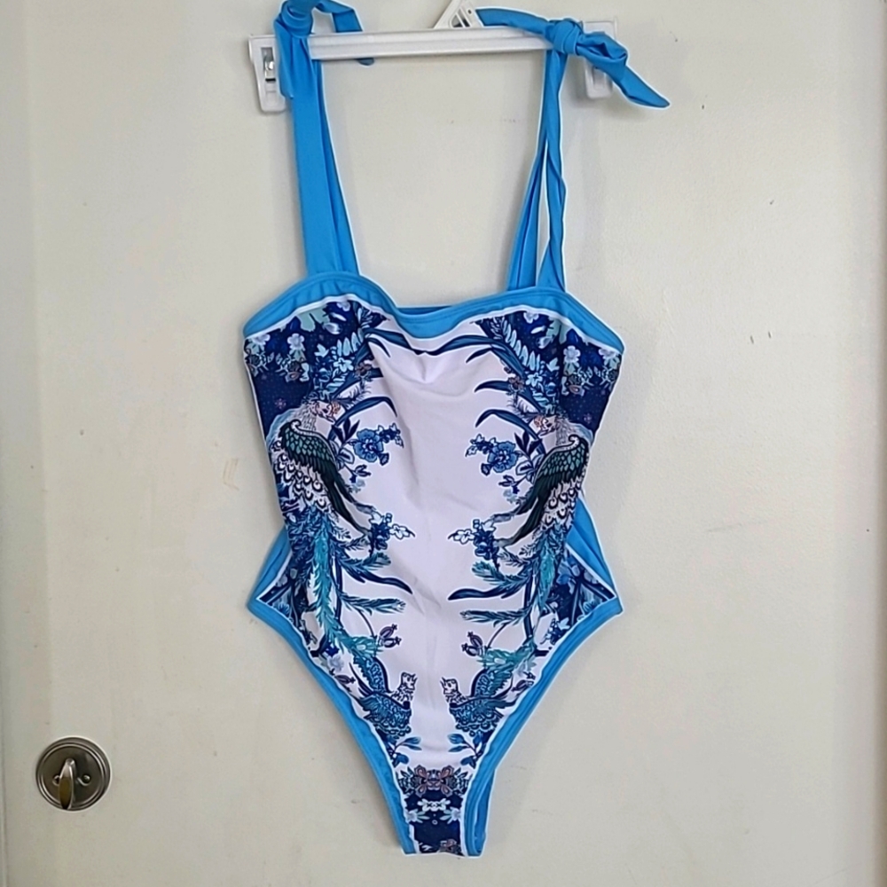 NEW WITH TAG SWIMSUIT WITH MATCHING COVER SKIRT. NEW WITH TAG.